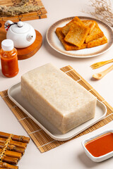 Raw Turnip cake (Chinese : Chai tow kway ). Turnip cake  is a common dish or dim sum of Teochew cuisine in Chaoshan, China usually cut into rectangular slices and sometimes pan-fried before serving.