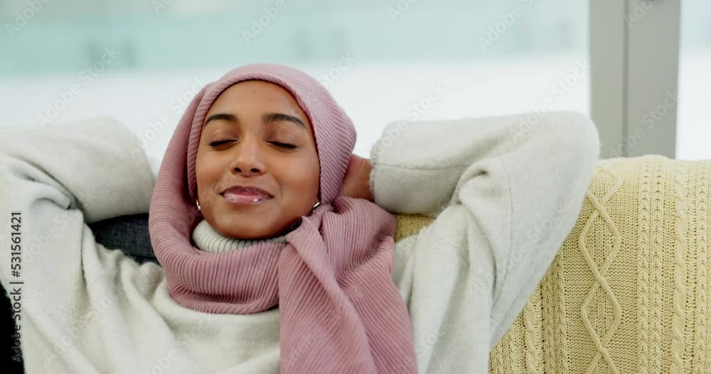 Canvas Prints Relax, freedom and happy with a muslim woman sitting on a sofa in her home living room alone. Smile, lounge and lifestyle with a young islamic female relaxing on a couch in her house on the weekend