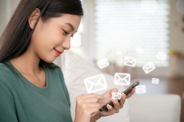 Asian woman hand using mobile phone with e-mail application, Concept email and newsletter