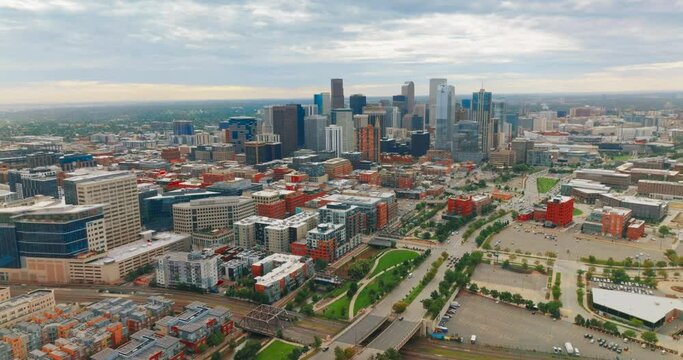 Beautiful bright Denver downtown with skyscrapers grouped together. Lovely city view on cloudy daytime from aerial perspective.