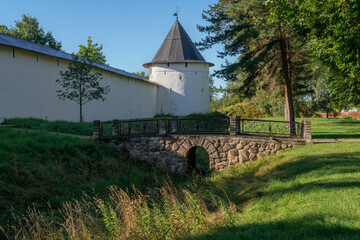 Fototapeta na wymiar View of the Tailovskaya Tower of the Holy Dormition Pskov-Pechersk Monastery on a sunny summer day, Pechory, Pskov region, Russia