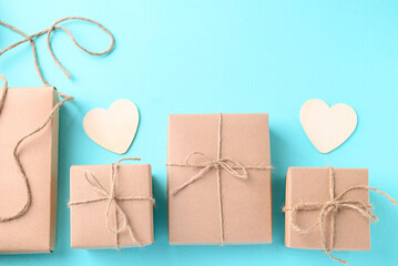Paper gift box with heart shape on light blue color background, Craft present for giving in special day and holiday