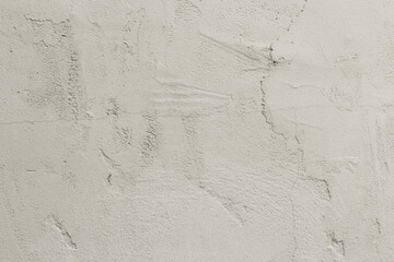 Texture of cracked concrete painted with pink paint with cracks and bumps. Wallpaper, Background. Close-up.