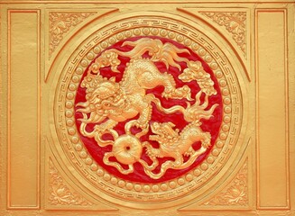 Wall decoration with golden dragon sculpture at Golden Temple in Dai Nam on 12 Nov 2016 - Vietnam