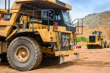 Fototapeta na wymiar Open pit mine industry, big yellow mining truck for coal anthracite.