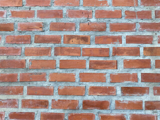 Old brick block concrete grunge wall texture background. Brown vintage brick wall close up 