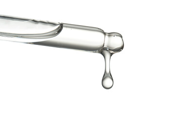 Pipette with a drop of cosmetic product on a white background.