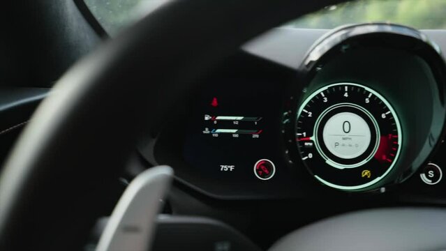 Luxury sport car digital dashboard, odometer, speedometer, fuel level.