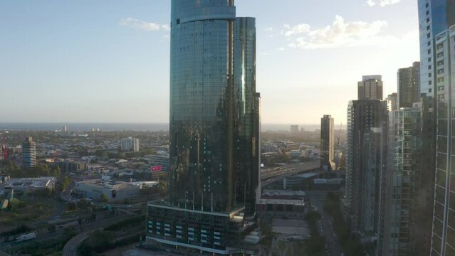 Aerial decent looking toward Southbank skyscrapers on gorgeous Melbourne afternoon.