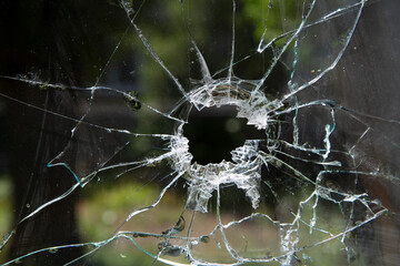 Window glass broken by a bullet. Aftermath of hostilities.