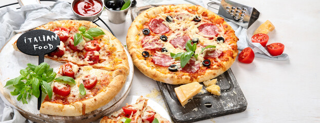 Freshly baked pizza on dark background.