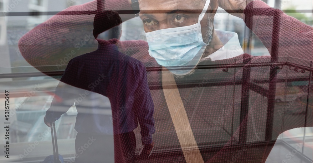 Poster Digital illustration of a man putting coronavirus covid19 mask over a man standing in an airport