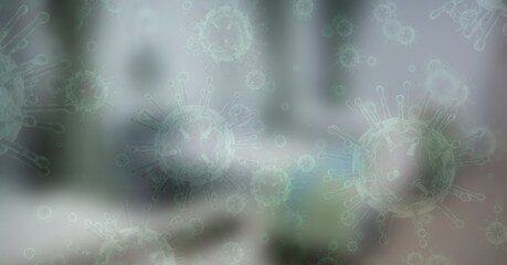 Digital illustration of macro Coronavirus Covid-19 cells floating over an empty hospital room