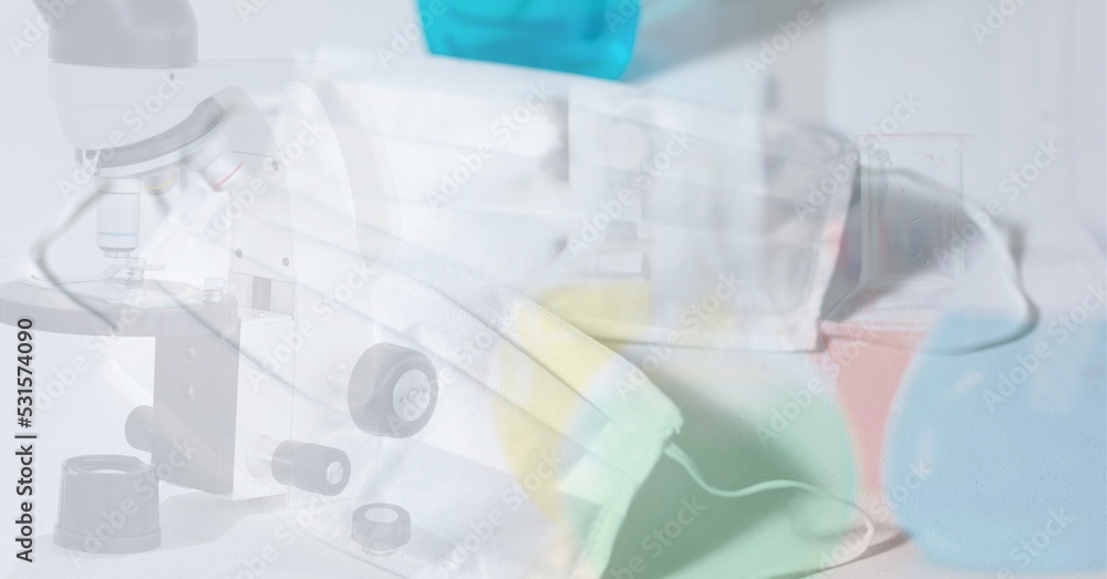 Poster digital illustration of a face mask lying on a table over a microscope