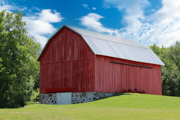 Fototapeta na wymiar retro vintage red old barn rural farming painted storage farmyard wooden farm buildings yard