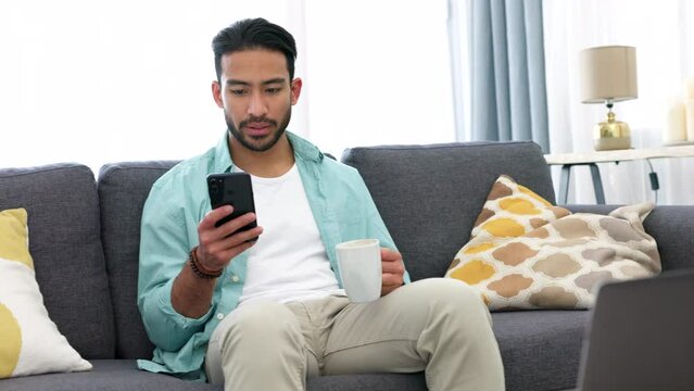 Smartphone, coffee break and relax man on sofa with home wifi for internet social media, networking online or video streaming on mobile app. Gen z guy check text message with espresso drink in lounge