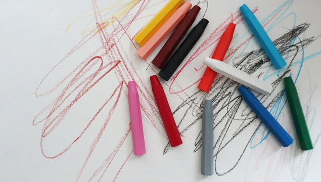 pencils on white background picture drawn by a baby colored pencil