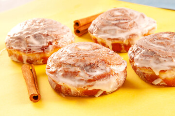 Obraz na płótnie Canvas Cinnamon hand made brioche doughnuts baked to perfection.