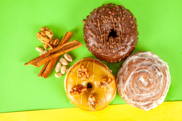 Gourmet three flavoured cinnamon, chocolate and maple walnut brioche doughnuts with ingredients.