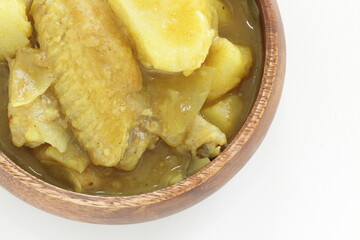 Chinese food, chicken and potato curry in wooden bowl