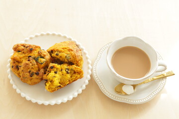 Homemade pumpkin scone and milk tea  for autumn breakfast food image 