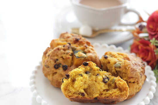 Homemade pumpkin scone and milk tea  for autumn breakfast food image 