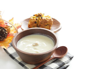 Homemade pumpkin scone and clam chowder for autumn breakfast  - obrazy, fototapety, plakaty