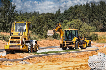 Construction site is laying new asphalt road pavement,road construction workers and road...