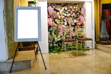 Interior design of a wedding chair with a floral background. Room with a frame