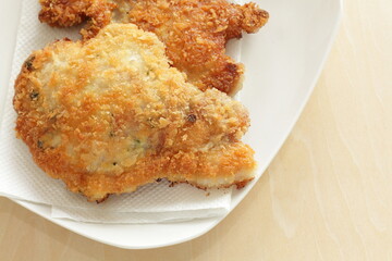 Homemade Japanese deep fried pork on wooden plate 