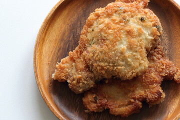 Homemade Japanese deep fried pork on wooden plate 