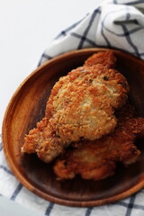 Homemade Japanese deep fried pork on wooden plate 
