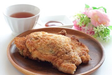Homemade Japanese deep fried pork on wooden plate 