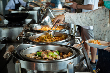 scooping the food, catering, dinner time