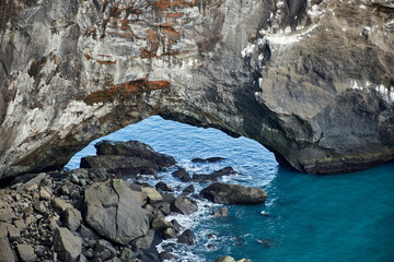 Close-up of famous rock arch in the Atlantic ocean at cape Dyrholaey, Vik, South coast of Iceland, Europe.