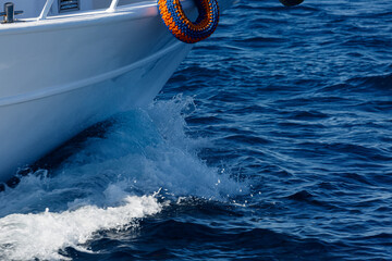 Waves and details from diving boat in the sea