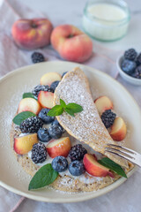Delicious homemade crepes with blueberries and riccota