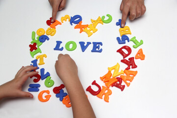 Children's game of colored letters form the word 