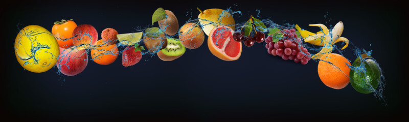Panorama with fresh fruits in water - avocado, orange, banana, grapes, cherry, grapefruit, pear,...