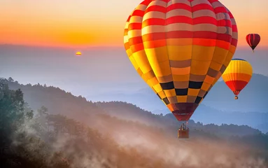 Poster Colorful hot air balloons flying over Doi Luang Chiang Dao at sunrise Chiang mai, Thailand. Hot air balloon above high mountain at sunse, sunrise. Sport and recreation © somchairakin