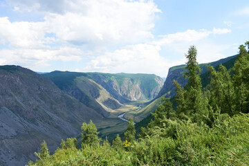 Pass in the Altai Mountains Katu - Yaryk. The river valley on a sunny day, a picturesque place. 