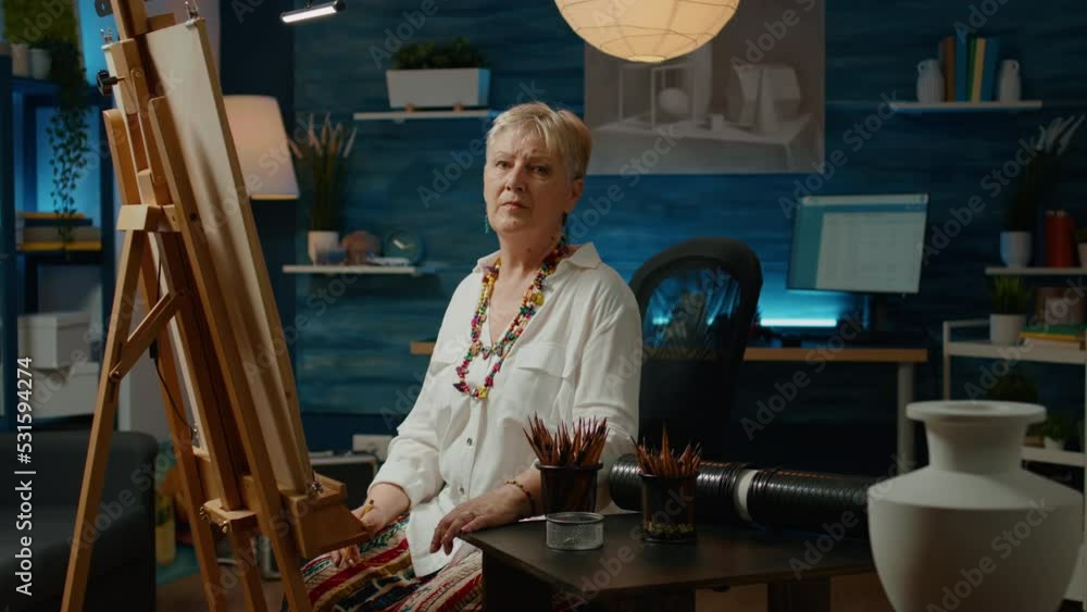 Poster portrait of senior artist drawing vase model on white canvas, using pencils and artistic tools to dr