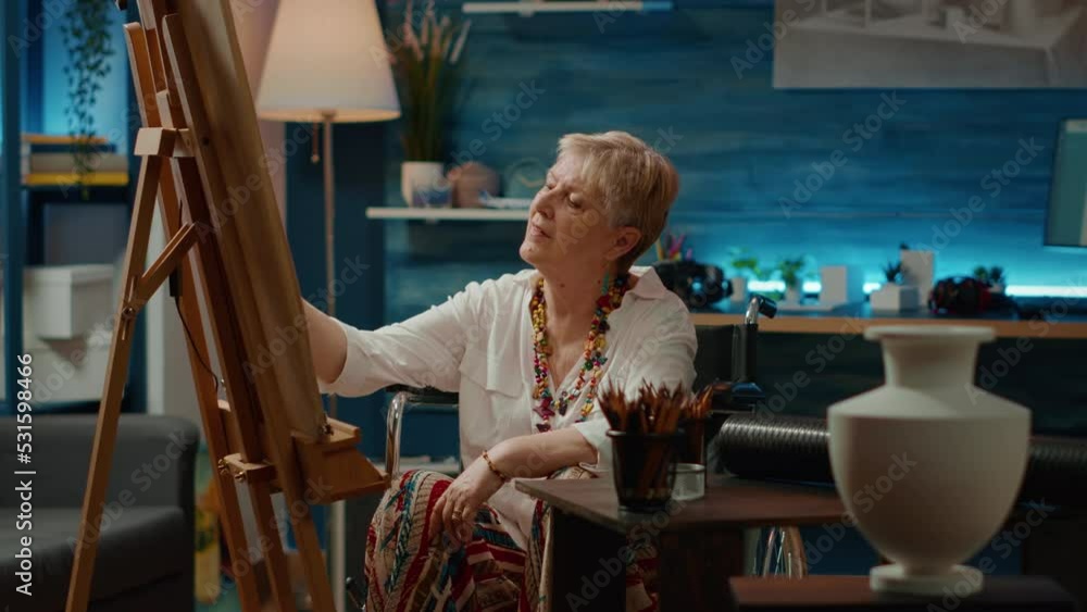Fototapete female artist with chronic disability drawing vase design using artistic tools and professional sket