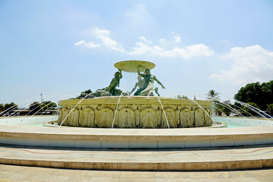 Triton Fountain At The Entrance Of The City Gates In Valletta, Malta Island