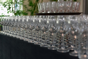 Empty drinking glasses on a black table ready for the evening party