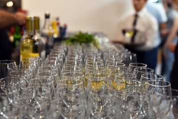 Empty drinking glasses on a black table ready for the evening party