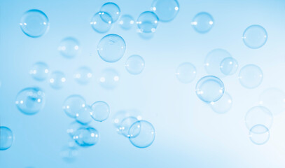 Fototapeta na wymiar Abstract Transparent Blue Soap Bubbles Background. Soap Sud Bubbles Water.
