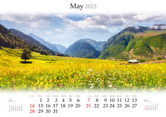 Wall calendar for 2023 year. May, B3 size. Set of calendars with amazing landscapes. Blooming yellow flowers on alpine meadows in Caucasus mountains, Georgia.  Monthly calendar ready for print.