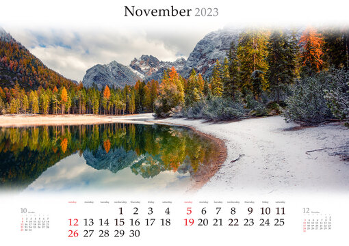 Wall calendar for 2023 year. November, B3 size. Set of calendars with amazing landscapes. First snow on Braies Lake. Colorful autumn view of Dolomite Alps, Italy. Monthly calendar ready for print..