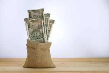 Five Hundred rupees note in a jute sack.